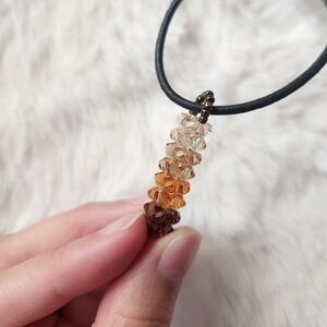 Hamdmade brown orange and tan beaded charm necklace